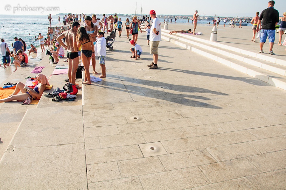 The holes in the pavement is the Sea Organ - a musical instrument which plays music by way of sea waves and tubes located underneath a set of large marble steps