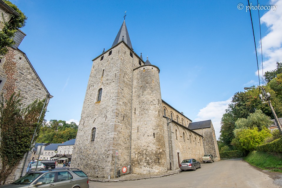 Stone church and blue sky in Celles