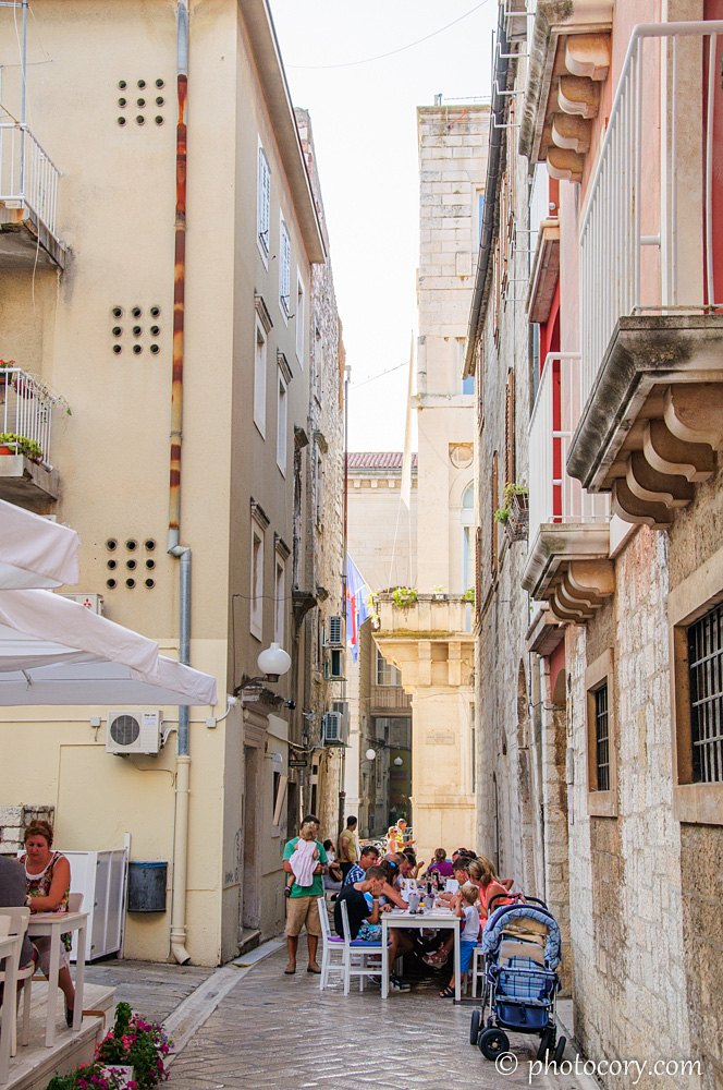 A narrow alley with restaurants