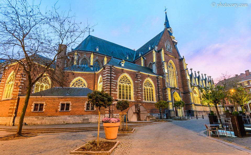 St. Quentin's Cathedral in Hasselt, Belgium, with warm, bright lights during evening 