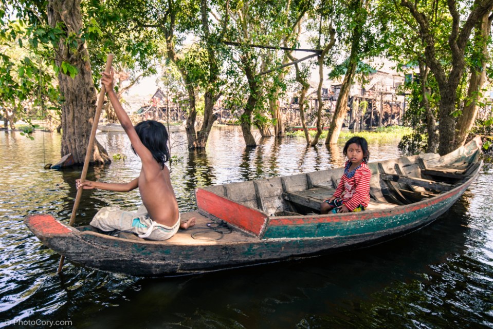 girls boat flooded forest