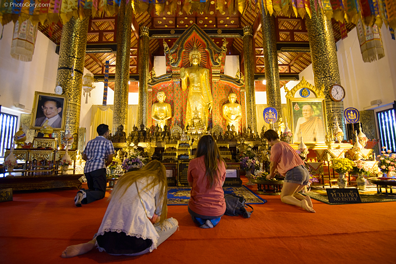 people praying temple thailand